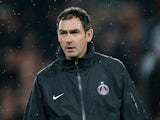 PSG coach Paul Clement leads a warm up prior to the Champions League match against Valencia on March 6, 2013