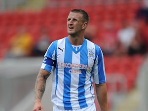 Huddersfield captain Clarke released