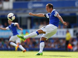 Phil Jagielka of Everton clears the ball during the Barclays Premier League match between Everton and West Bromwich Albion at Goodison Park on August 24, 2013 