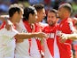 Monaco's Radamel Falcao is congratulated by team mates after scoring the opening goal from the penalty spot during the match against FC Lorient on September 15, 2013