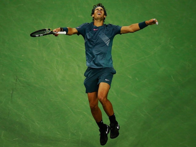 Rafael Nadal falls to the ground as he wins the US Open in New York on September 9, 2013