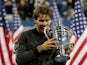 Rafael Nadal poses with the US Open trophy after defeating Novak Djokovic in four sets in New York on September 9, 2013