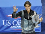 Rafael Nadal holds the championship trophy after his win over Novak Djokovic during the men's final of the US Open on September 13, 2010