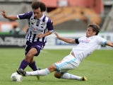 Toulouse's forward Martin Braithwaite vies with Marseille's defender Lucas Mendes during a game on September 14, 2013