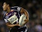 Willie Isa of the Storm is tackled by Bill Tupou of the Warriors during the round seven NRL match between the Melbourne Storm and the Warriors at Etihad Stadium on April 25, 2010
