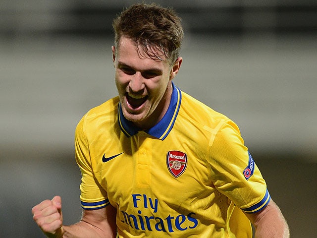 Arsenal's Aaron Ramsey celebrates after scoring his team's second goal against Marseille during their Champions League group match on September 18, 2013