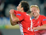 Freiburg's Admir Mehmedi celebrates with team mate Mike Hanke after scoring his team's second goal against Slovan Liberec during their Europa League group match on September 19, 2013