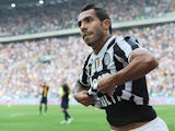 Juventus' Carlos Tevez celebrates after scoring the equaliser against Hellas Verona during their Serie A match on September 22, 2013