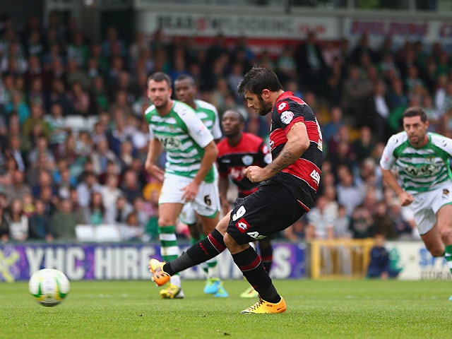 QPR's Charlie Austin scores the opening goal from the penalty spot against Yeovil during their Championship match on September 21, 2013
