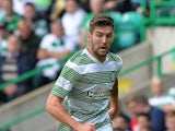 Charlie Mulgrew of Celtic in action during the Scottish Premier League game between Celtic and Ross County at Celtic Park Stadium on August 03, 2013