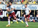 Torino's Danilo D'ambrosio celebrates with teammates after scoring the opening goal against Bologna during their Serie A on September 22, 2013