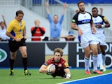 Saracens' David Strettle dives over to score a try against Bath during their Aviva Premiership match on September 22, 2013