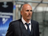 Marseille's French head coach Elie Baup leaves the pitch at the end of the UEFA Champions League group F football match Marseille vs. Arsenal on September 18, 2013