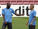 Barcelona's French defender Eric Abidal and Barcelona's Brazilian defender Daniel Alves take part in a training session at the Camp Nou stadium in Barcelona on April 2, 2012