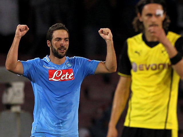Napoli's Gonzalo Higuain celebrates after scoring the opening goal against Dortmund in their Champions League group match on September 18, 2013