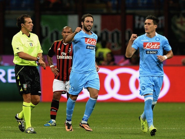 Napoli striker Gonzalo Higuain celebrates a goal against Milan on September 22, 2013
