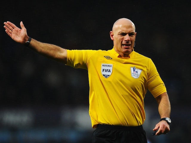 Referee Howard Webb signals for a free kick during the match between West Ham United and Queens Park Rangers at Upton Park on January 19, 2013
