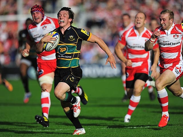 Northampton Saints' James Wilson races ahead to score a try against Gloucester during their Aviva Premiership match on September 21, 2013