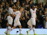 Tottenham's Jermain Defoe celebrates with team mates after scoring the opening goal against Tromso IL during their Europa League group match on September 19, 2013