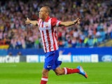 Atletico Madrid's Joao Miranda celebrates after scoring the opening goal against Zenit during their Champions League group match on September 18, 2013