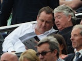 Newcastle chairman Mike Ashley speaks to director of football Joe Kinnear during the game with Hull on September 21, 2013