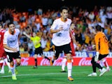 Valencia's Jonas Goncalves celebrates a goal against Sevilla on September 22, 2013
