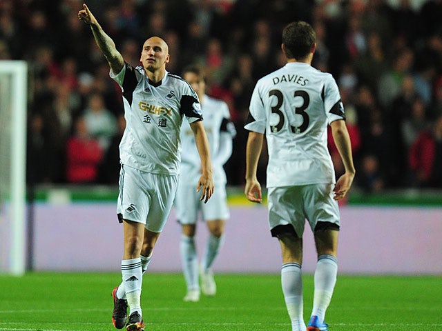 Swansea's Jonjo Shelvey celebrates after scoring the opening goal against Liverpool on September 16, 2013