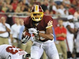 Wide receiver Jordan Reed #86 of the Washington Redskins runs upfield with a pass against the Tampa Bay Buccaneers August 29, 2013