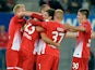 Freiburg's Julian Schuster is congratulated by team mates after scoring the opening goal against Slovan Liberec during their Europa League group match on September 19, 2013