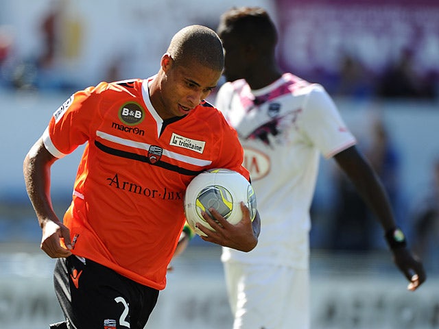 Lorient's Kevin Monnet-Paquet celebrates after scoring his team's second goal against Bordeaux during their Ligue 1 match on September 22, 2013