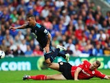 Tottenham's Kyle Walker is tackled by Cardiff's Ben Turner during their Premier League match on September 22, 2013