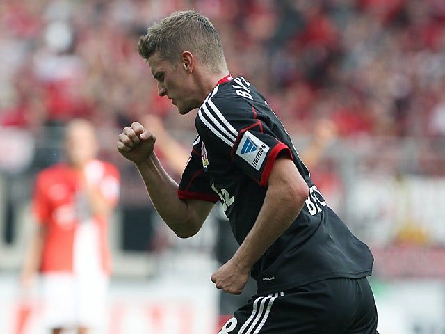 Leverkusen's Lars Bender celebrates after scoring his team's second goal against Mainz during their Bundesliga match on September 21, 2013