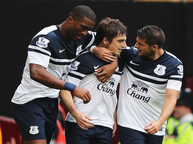 Everton's Leighton Baines is congratulated by teammates after scoring a free-kick against West Ham on September 21, 2013