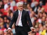 Stoke manager Mark Hughes on the touchline during his team's Premier League match against Arsenal on September 22, 2013