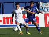 Marseille's Mathieu Valbuena and Bastia's Yannick Cahuzac battle for the ball during their Ligue 1 match on September 21, 2013