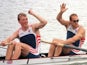 Matthew Pinsent and Steve Redgrave wave to the crowd after winning gold in the coxless pairs at the Atlanta Olympics on July 27, 1996