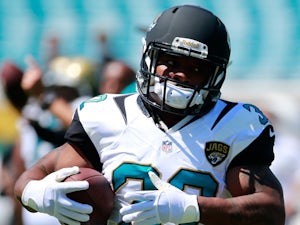 Maurice Jones-Drew #32 of the Jacksonville Jaguars warms before the game against the Kansas City Chiefs at EverBank Field on September 8, 2013