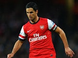 Arsenal's Mikel Arteta in action against Wigan during their Premier League match on May 14, 2013