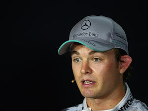Rosberg tops first practice