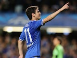 Chelsea's Oscar celebrates after scoring the opening goal against Basel during their Champions League group match on September 18, 2013