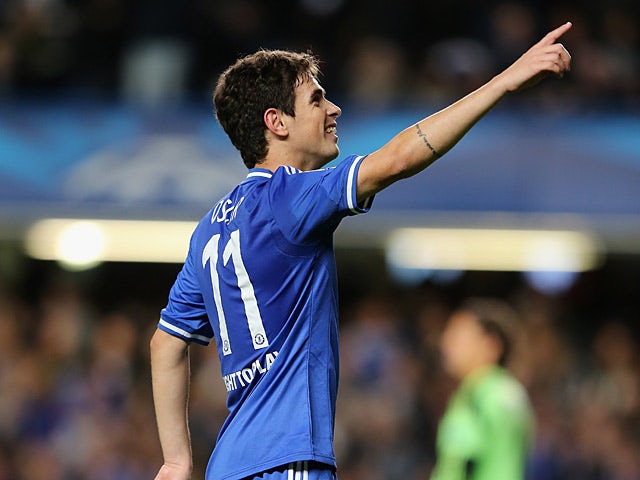 Chelsea's Oscar celebrates after scoring the opening goal against Basel during their Champions League group match on September 18, 2013