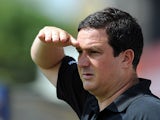 Mansfield Town manager Paul Cox watches his team play Nottingham Forest during a friendly match on July 13, 2013
