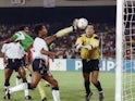 Cameroon's forward Frantois Omam Biyik tries to kick the ball past English goalkeeper Peter Shilton during their World Cup match on July 1, 1990