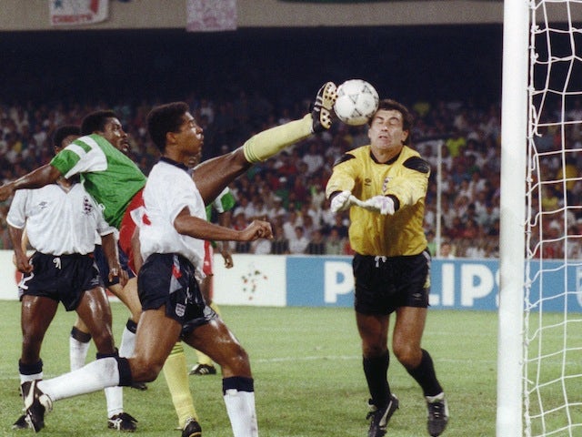 Cameroon's forward Frantois Omam Biyik tries to kick the ball past English goalkeeper Peter Shilton during their World Cup match on July 1, 1990