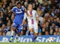 Chelsea's Samuel Eto'o and Basel's Kay Voser battle for the ball during their Champions League group match on September 18, 2013