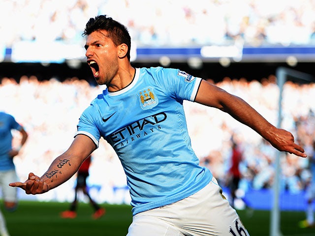 Manchester City's Sergio Aguero celebrates after scoring the opening goal against Manchester United during their Premier League match on September 22, 2013