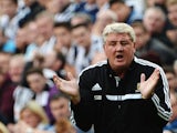 Hull boss Steve Bruce encourages his players during the game with Newcastle on September 21, 2013