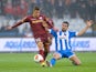 Zulte Waregem's Thorgan Hazard and Wigan's Jordi Gomez battle for the ball during their Europa League group match on September 19, 2013