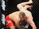 Johny Hendricks (L) holds on to TJ Grant in their welterweight bout at UFC 113 at Bell Centre on May 8, 2010