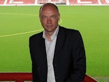 Uwe Rosler poses pitch-side as he is announced as the new manager of Brentford FC, at Griffin Park on June 16, 2011